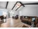 Open living room with exposed beam ceiling and hardwood floors at 1104 Margaret Dr, Ladson, SC 29456