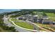 An impressive aerial view of the golf course and clubhouse showcasing the landscaped grounds and stunning architecture of the community at 113 High Hammock Villas, Seabrook Island, SC 29455