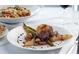 Mouthwatering steak dish plated with potatoes, pears, asparagus, and drizzled with a rich balsamic glaze at 113 High Hammock Villas, Seabrook Island, SC 29455