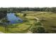 Scenic golf course view with lush green fairways, mature trees, water features, and players teeing off at 113 High Hammock Villas, Seabrook Island, SC 29455
