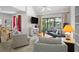 Bright living room featuring vaulted ceilings, modern furnishings and a sliding glass door to a balcony at 113 High Hammock Villas, Seabrook Island, SC 29455