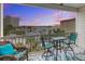 Inviting outdoor patio with comfortable seating and scenic ocean views at sunset at 114 W Arctic Ave # B302, Folly Beach, SC 29439