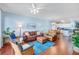 Bright and spacious living room boasts comfortable seating, wooden floors, and stylish décor at 114 W Arctic Ave # B302, Folly Beach, SC 29439