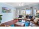 Cozy living room with balcony access featuring comfortable seating and modern décor at 114 W Arctic Ave # B302, Folly Beach, SC 29439