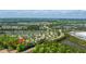 A neighborhood aerial view with lush greenery, homes, and a scenic pond nearby at 1209 River Rock Rd, Hanahan, SC 29410