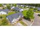 See the beautiful landscaping and cozy front porch of this home from above at 1209 River Rock Rd, Hanahan, SC 29410