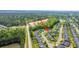 Breathtaking aerial view showcasing the home's location near lush woodlands and a developing area, blending nature and convenience at 1209 River Rock Rd, Hanahan, SC 29410