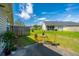 Inviting backyard with well-manicured lawn, chairs and table on the patio at 1209 River Rock Rd, Hanahan, SC 29410