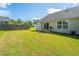 Enjoy the outdoors in this grassy backyard with a patio, perfect for entertaining and relaxation at 1209 River Rock Rd, Hanahan, SC 29410