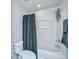 Bathroom with gray accents, toilet, and shower/tub combination with shower curtain at 1209 River Rock Rd, Hanahan, SC 29410