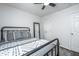 Cozy bedroom with a wrought iron bed frame, ceiling fan, and neutral decor at 1209 River Rock Rd, Hanahan, SC 29410