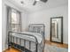 Cozy bedroom with a metal-frame bed, natural light, and mirrored closet adding space at 1209 River Rock Rd, Hanahan, SC 29410