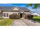 Cozy single-story home featuring a well-kept lawn and neat landscaping at 1209 River Rock Rd, Hanahan, SC 29410