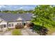 Charming home with lush landscaping, a well-manicured lawn, and a welcoming entrance, perfect for Gathering living at 1209 River Rock Rd, Hanahan, SC 29410