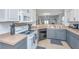 Well-lit kitchen with modern appliances and gray cabinets, offering a functional cooking space at 1209 River Rock Rd, Hanahan, SC 29410