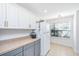 Well-appointed kitchen featuring white cabinets, ample countertop space, and modern appliances at 1209 River Rock Rd, Hanahan, SC 29410