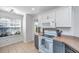 Bright kitchen with a view from the window, featuring white cabinets and modern appliances at 1209 River Rock Rd, Hanahan, SC 29410