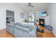Inviting living room featuring a fireplace, vaulted ceiling, and sliding glass doors to the outdoor area at 1209 River Rock Rd, Hanahan, SC 29410