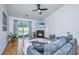 Spacious living room featuring a fireplace and sliding glass doors to the yard at 1209 River Rock Rd, Hanahan, SC 29410