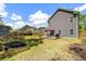 Backyard showcasing the patio, lawn and the home's gray exterior at 1233 Updyke Dr, Johns Island, SC 29455