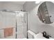 Bathroom featuring a glass-enclosed shower, round mirror, and modern vanity with ample storage space at 1233 Updyke Dr, Johns Island, SC 29455
