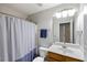 Bathroom featuring a shower and bathtub combination, a vanity with sink, and a mirror with lighting at 1233 Updyke Dr, Johns Island, SC 29455