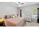 Cozy bedroom featuring plush bedding, bedside lamps, and a classic white cabinet for storage and organization at 1233 Updyke Dr, Johns Island, SC 29455