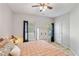 Bedroom showcasing comfortable bedding, bright windows with view, and a storage cabinet for organizing clothes at 1233 Updyke Dr, Johns Island, SC 29455