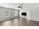 Bright bedroom with stylish gray flooring, a ceiling fan, and plenty of natural light from two windows at 1233 Updyke Dr, Johns Island, SC 29455