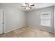 A well-lit bedroom showcasing neutral walls, a ceiling fan and a window at 1233 Updyke Dr, Johns Island, SC 29455