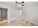 A bright bedroom featuring a ceiling fan with carpet flooring throughout at 1233 Updyke Dr, Johns Island, SC 29455