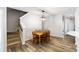 Inviting dining area features hardwood floors, a stylish light fixture and classic wood table set, perfect for Gathering meals at 1233 Updyke Dr, Johns Island, SC 29455