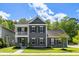 Charming two-story home with a welcoming porch and beautifully landscaped front yard at 1233 Updyke Dr, Johns Island, SC 29455
