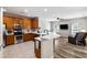 Well-lit kitchen with a breakfast bar and stainless steel appliances seamlessly connects to the living area at 1233 Updyke Dr, Johns Island, SC 29455