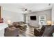 Cozy living room is brightly lit with lots of seating and a ceiling fan for comfort at 1233 Updyke Dr, Johns Island, SC 29455