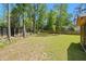 This sizable, lush backyard showcases a well-maintained lawn and sturdy fencing, ideal for outdoor enjoyment at 1325 Wannamaker Ave, Summerville, SC 29485