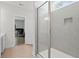 Modern bathroom featuring a glass-enclosed shower and tile walls that flow into the adjacent bedroom at 1325 Wannamaker Ave, Summerville, SC 29485