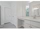 Modern bathroom featuring a vanity with a light countertop, accompanied by sleek gray tiling in the shower at 1325 Wannamaker Ave, Summerville, SC 29485
