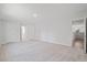 Large bedroom with neutral carpet, a doorway to a bathroom, and an open doorway to a different room at 1325 Wannamaker Ave, Summerville, SC 29485