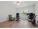 Versatile bedroom featuring wood floors, a ceiling fan, and an array of furniture including a desk and recliner at 1325 Wannamaker Ave, Summerville, SC 29485