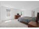 Light filled bedroom with carpet, a bed, windows, and furniture at 1325 Wannamaker Ave, Summerville, SC 29485