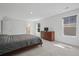 Carpeted bedroom with windows, a television atop a wooden dresser, and a bathroom doorway at 1325 Wannamaker Ave, Summerville, SC 29485