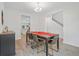 Formal dining room with a stylish table and chairs, complemented by modern lighting and wood flooring at 1325 Wannamaker Ave, Summerville, SC 29485