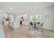 Bright, open-concept kitchen and dining area with wood floors and plenty of natural light at 1325 Wannamaker Ave, Summerville, SC 29485