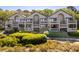 Aerial view of condo community surrounded by lush greenery and manicured landscaping at 1342 Pelican Watch Villas, Seabrook Island, SC 29455