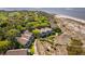 Lovely aerial perspective of beachfront villas featuring private balconies and walkway access to the shore at 1342 Pelican Watch Villas, Seabrook Island, SC 29455