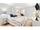 Airy bedroom with a cozy bed, a sunny bay window, and stylish décor at 1342 Pelican Watch Villas, Seabrook Island, SC 29455