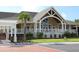 Exterior of charming building with covered porch, white columns and green lawn at 1342 Pelican Watch Villas, Seabrook Island, SC 29455
