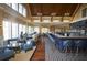 Beautiful clubhouse bar with high ceilings, ample seating, and stylish lighting for an inviting atmosphere at 1342 Pelican Watch Villas, Seabrook Island, SC 29455