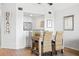 The dining area includes modern decor with a wooden table and wicker chairs, creating an inviting atmosphere at 1342 Pelican Watch Villas, Seabrook Island, SC 29455